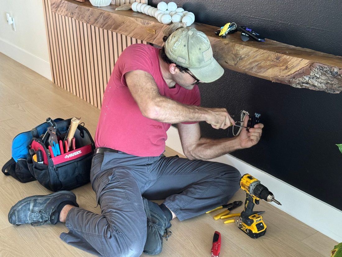 Dan Cicirelli doing a repair during his weekly free handyman day